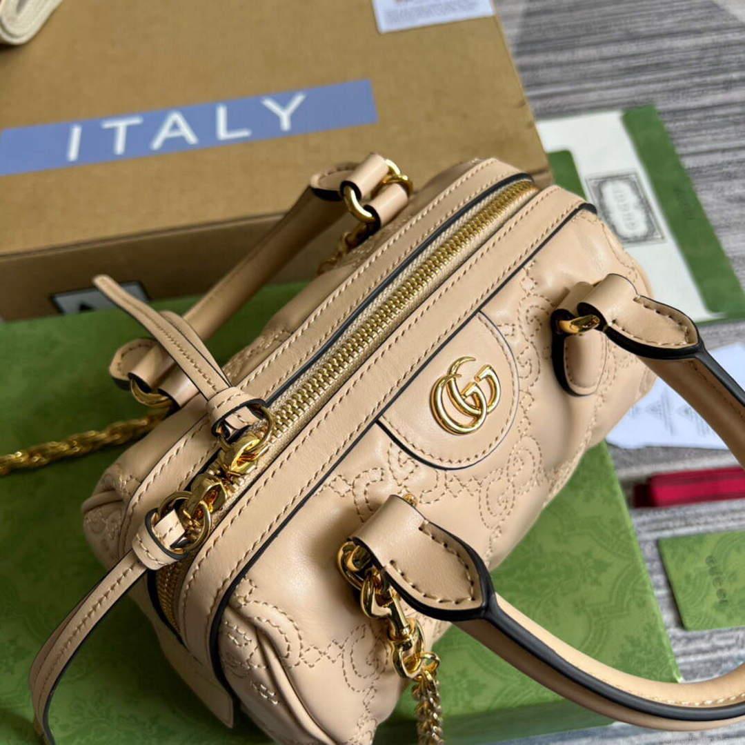 Gucci 702251 GG matelassé leather top handle bag Beige