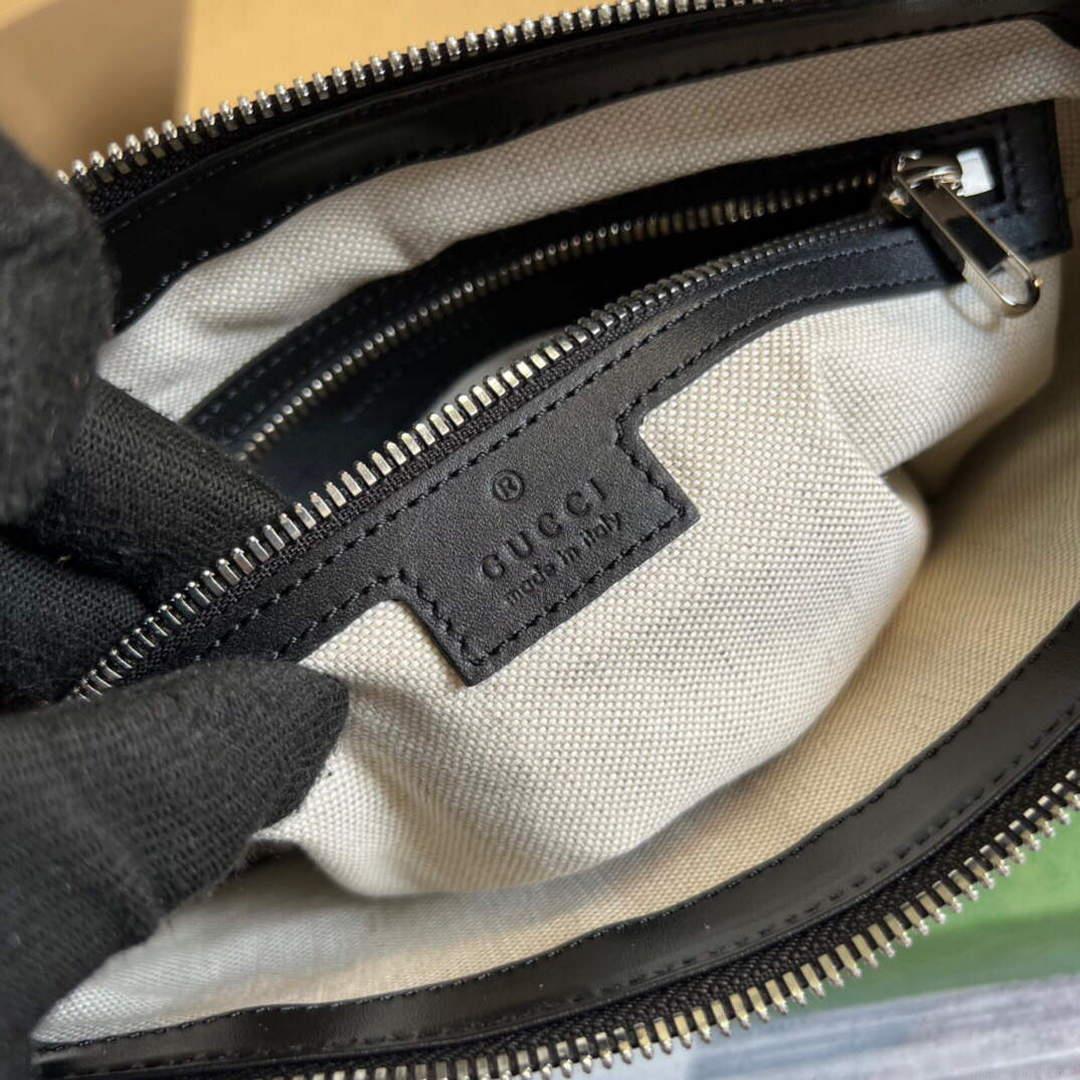 Gucci 406410 GG embossed small messenger bag Black