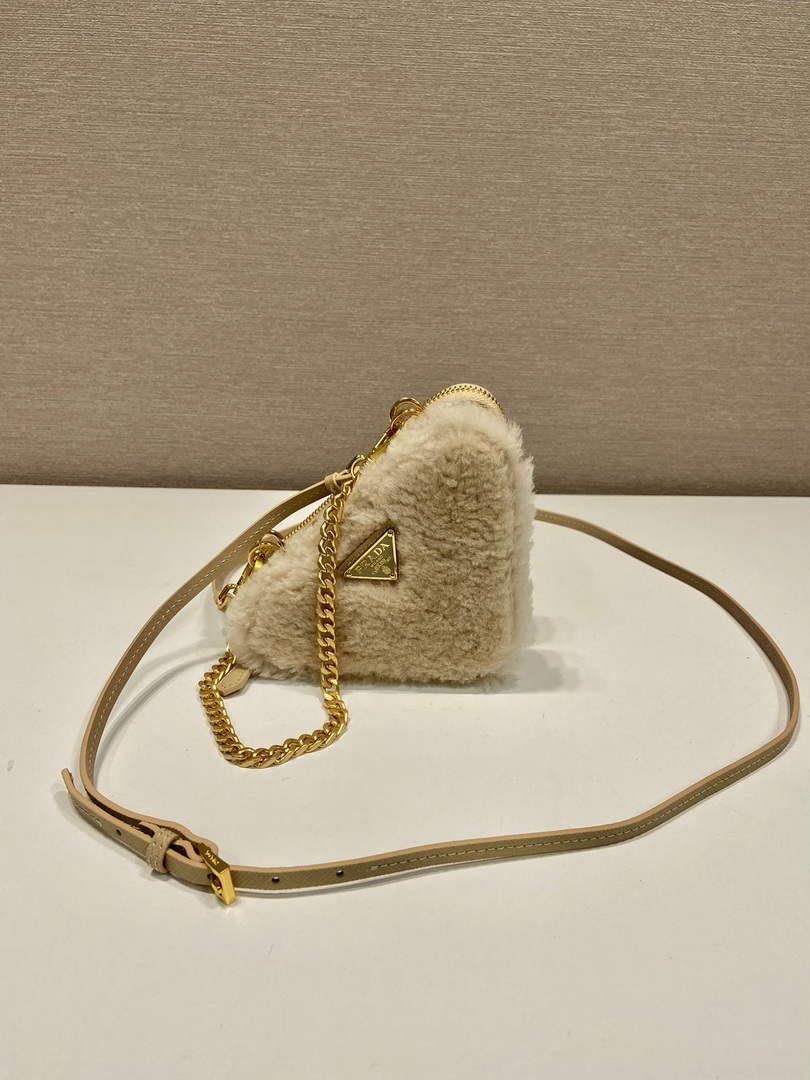 Prada 1NR015 Shearling and Saffiano leather mini-pouch Gold